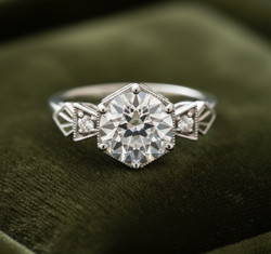 Art Deco engagement ring on dark olive green velvet