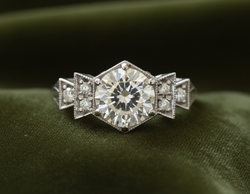 Art Deco ring on dark olive green velvet