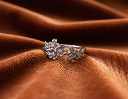 Dogwood Floral Engagement Ring on Dark Burnt Orange Velvet