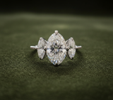 Engagement ring on dark olive green velvet