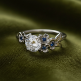 Ring on dark olive green velvet