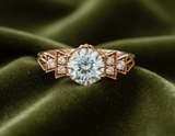 The Florence ring with light blue diamond on dark olive velvet